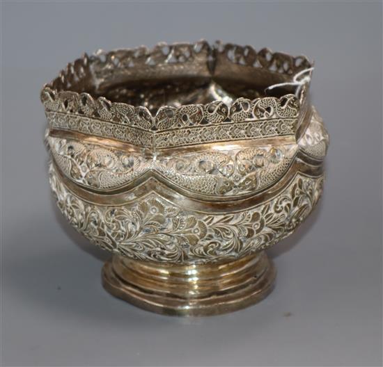 A Burmese white metal circular bowl with pierced hexagonal border, 10 oz.